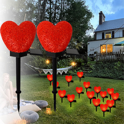 LAIAMER red heart solar light installed in a yard creates a romantic evening atmosphere
