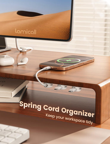 Lamicall cable management clip mounted on a desk for clutter-free workspace.