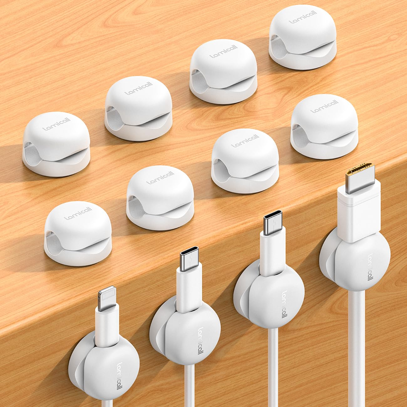 Lamicall spring cord organizer clip on a desk keeps cables tidy and accessible.