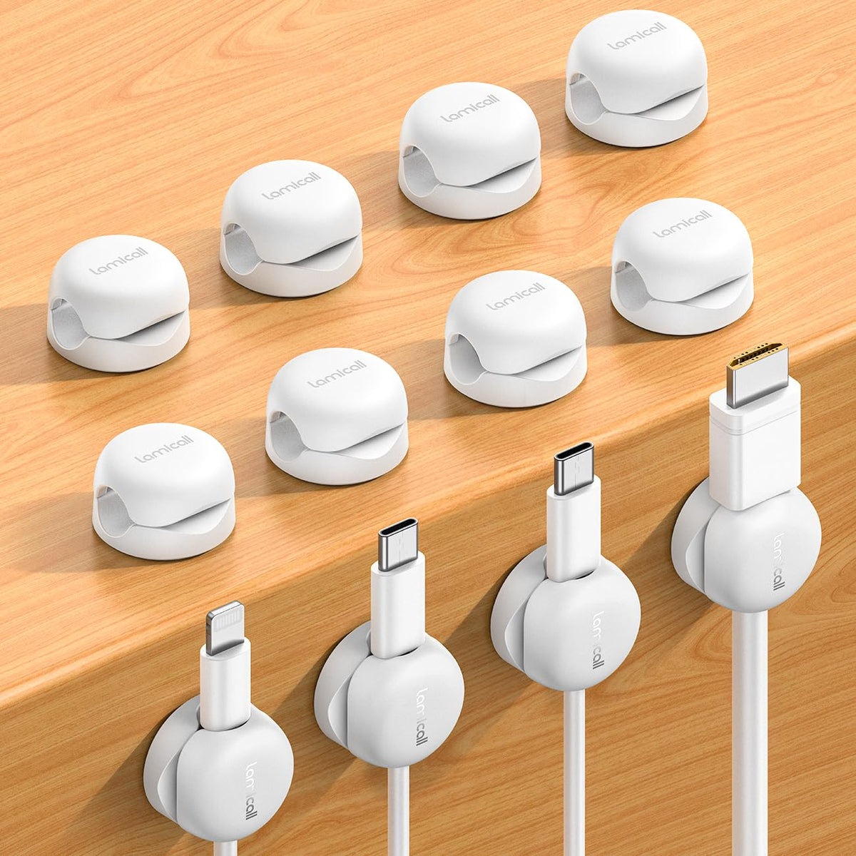 Lamicall spring cord organizer clip on a desk keeps cables tidy and accessible.