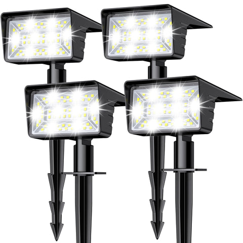 LAMKEEP solar spot light with 60 LEDs lighting a garden path