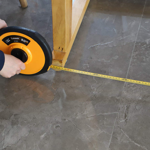 LAND portable long tape measure carried on site for on-the-go measuring