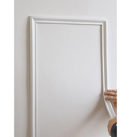 LaRolls white 3D wall molding strip along the ceiling edge adds dimension.