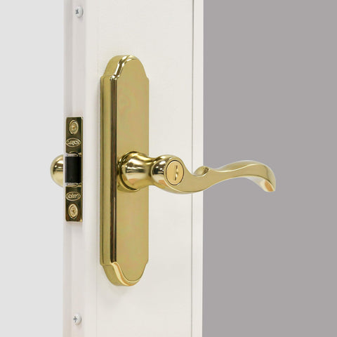 Larson storm door M2 brass handle close-up highlighting durable finish and smooth operation.