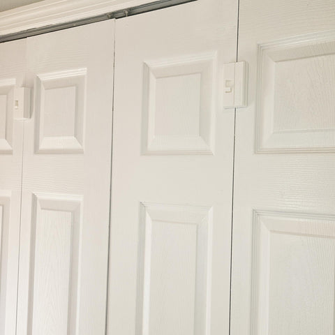LatchSmart bifold lock mounted on door for easy child safety