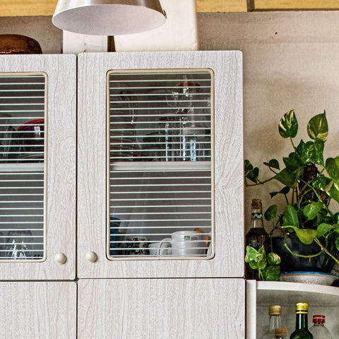 Latico room setup shows versatile white wood wallpaper in kitchen and living areas.