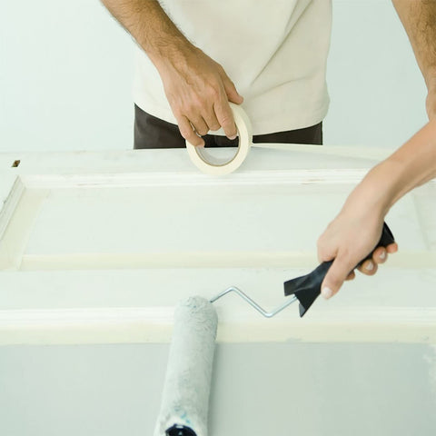Tape applied to a skirting board by Lazybug Studio for precise masking