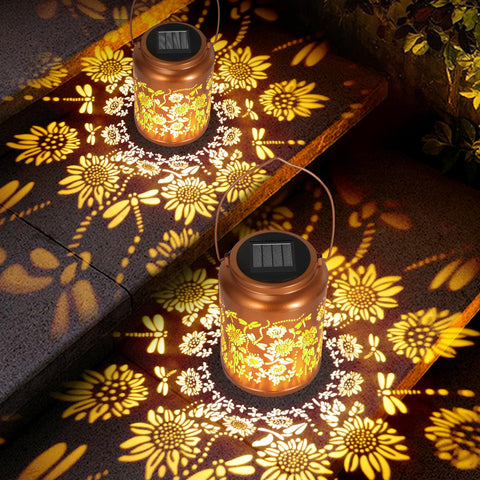 Lazzgan solar sunflower lantern hanging in a tree projecting butterfly patterns