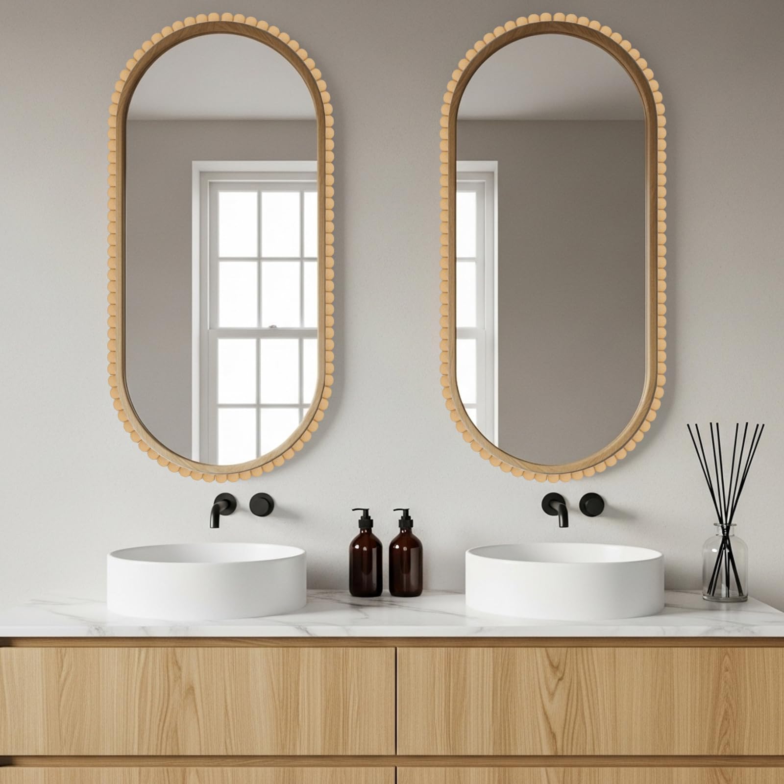 Leinuosen mirror frame trim with semi-pearl detail creates a refined bathroom look