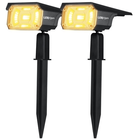 LEREKAM 40-LED solar spotlights illuminate a garden path at dusk, energy-saving outdoor lighting.