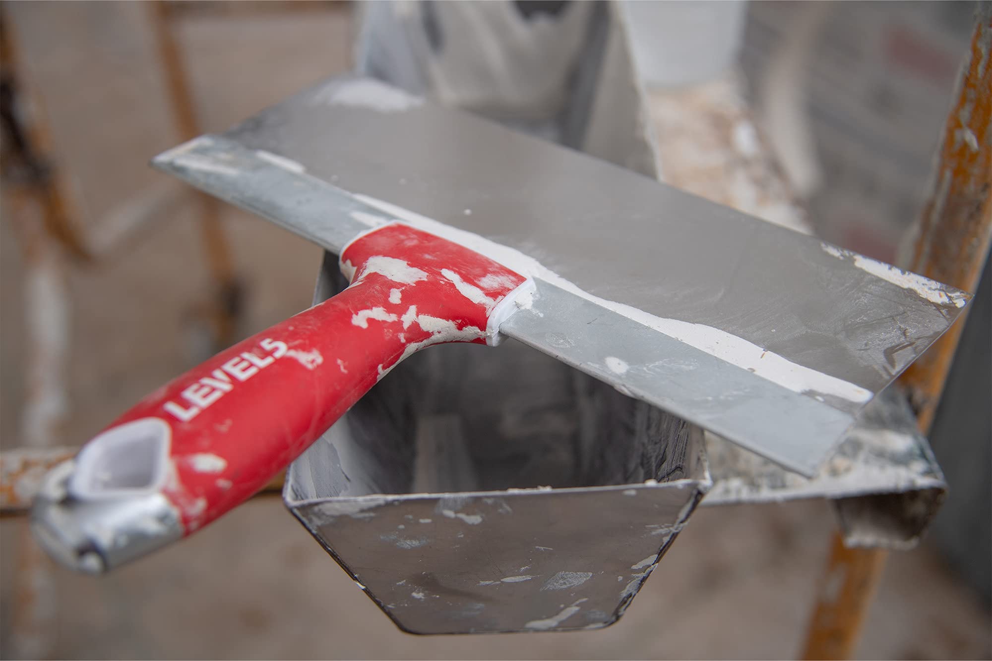 LEVEL5 drywall knife shows hammer-end feature for nail resets and blade protection