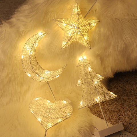  Lewondr heart lamp creates a soft glow for late-night reading.