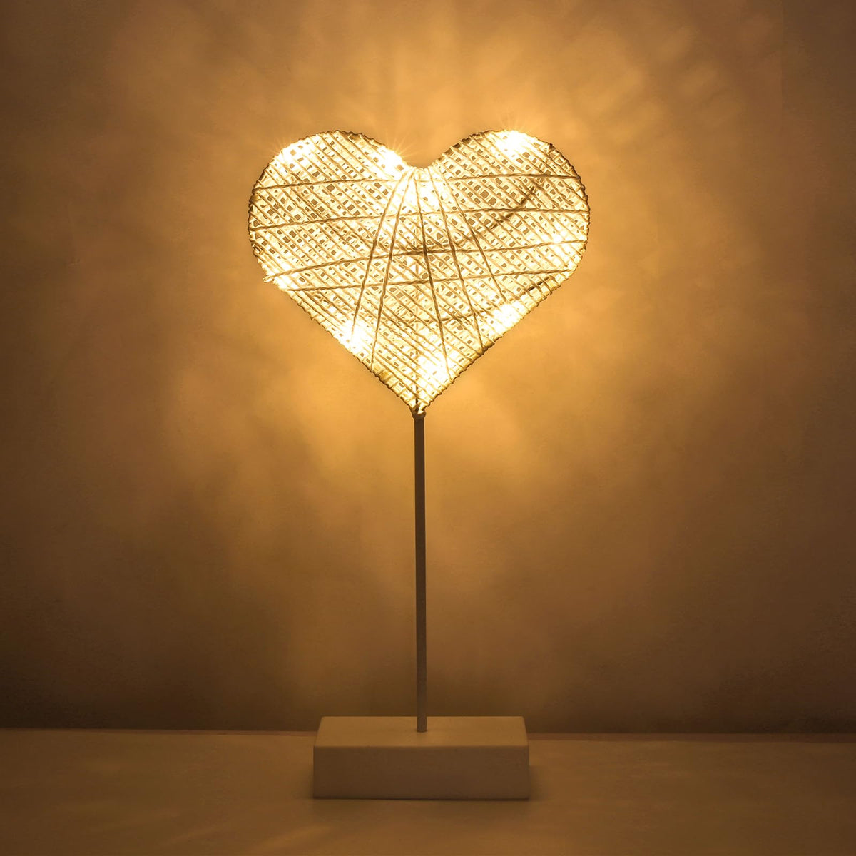  Lewondr heart lamp wrapped in cotton thread adds cozy desk ambiance.