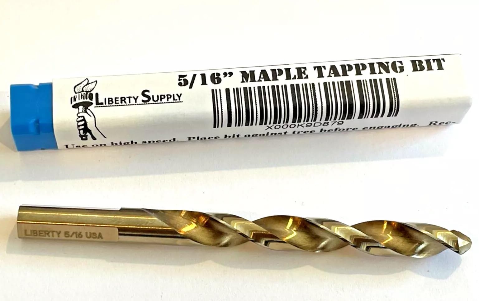 Liberty Supply tapping bit in action drilling into a maple tree.