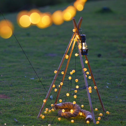 Lightique plug-in LED string lights with spheres for hassle-free indoor and outdoor decor.