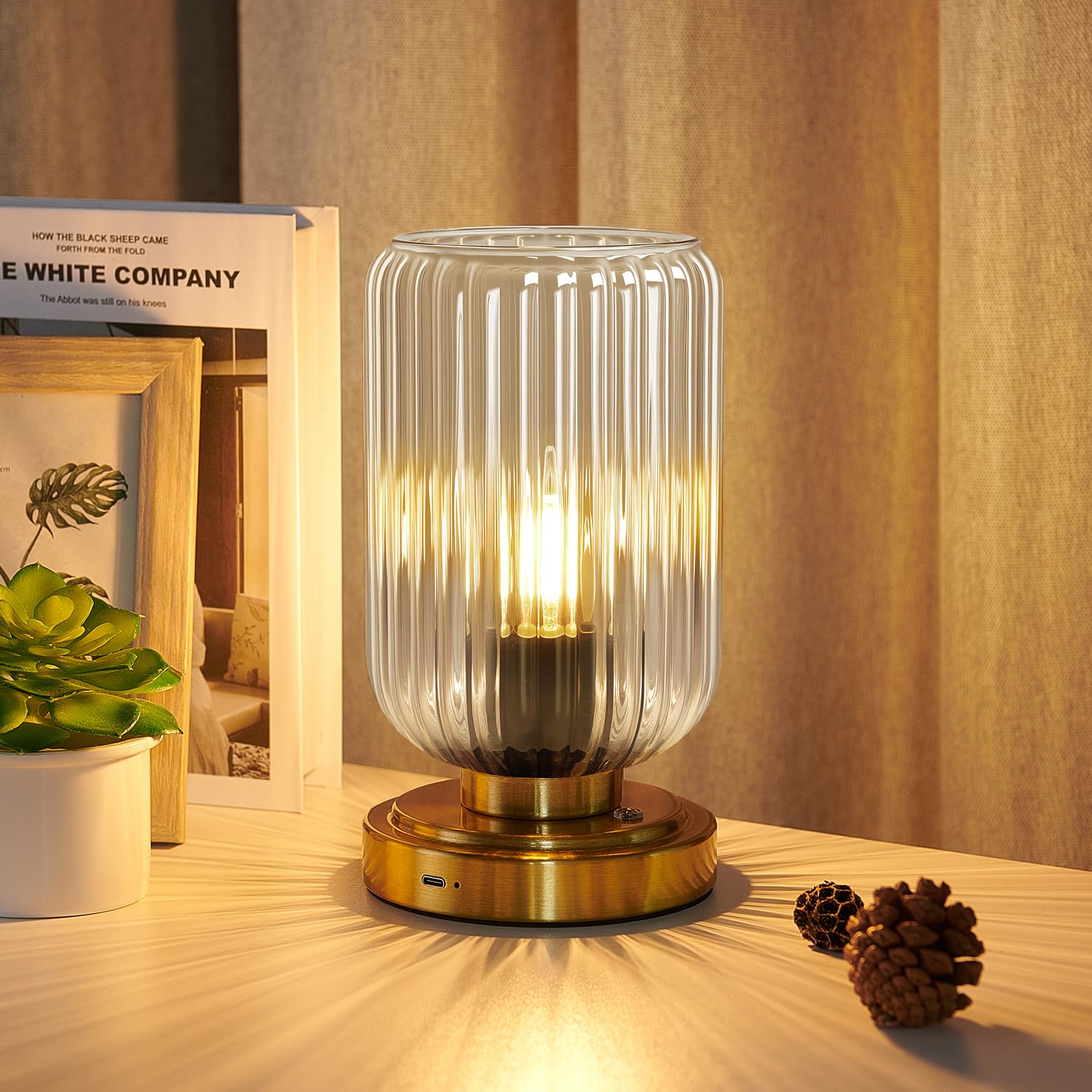 LightRound touch table lamp with glass shade offers gentle bedside lighting for evenings.