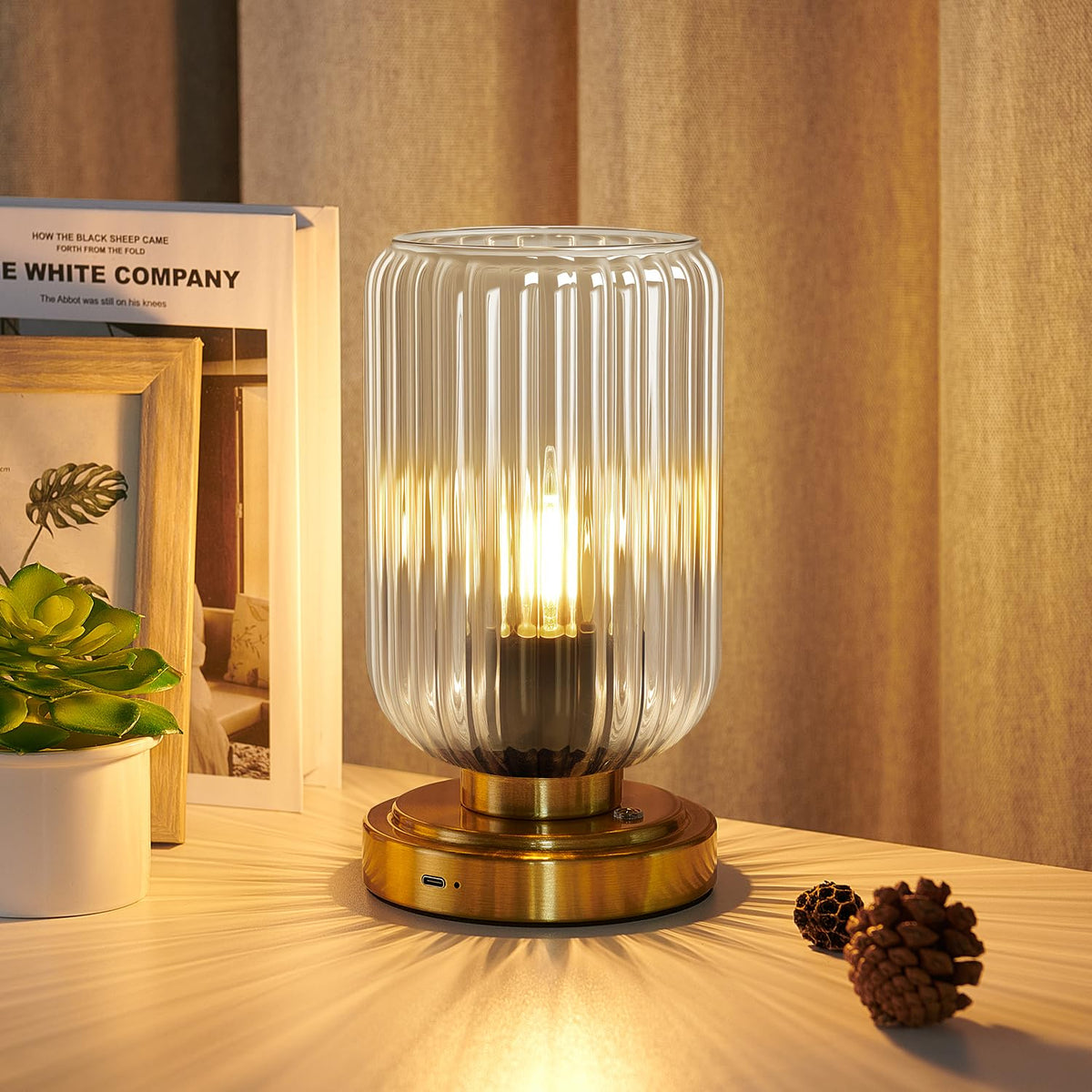 LightRound touch table lamp with glass shade offers gentle bedside lighting for evenings.