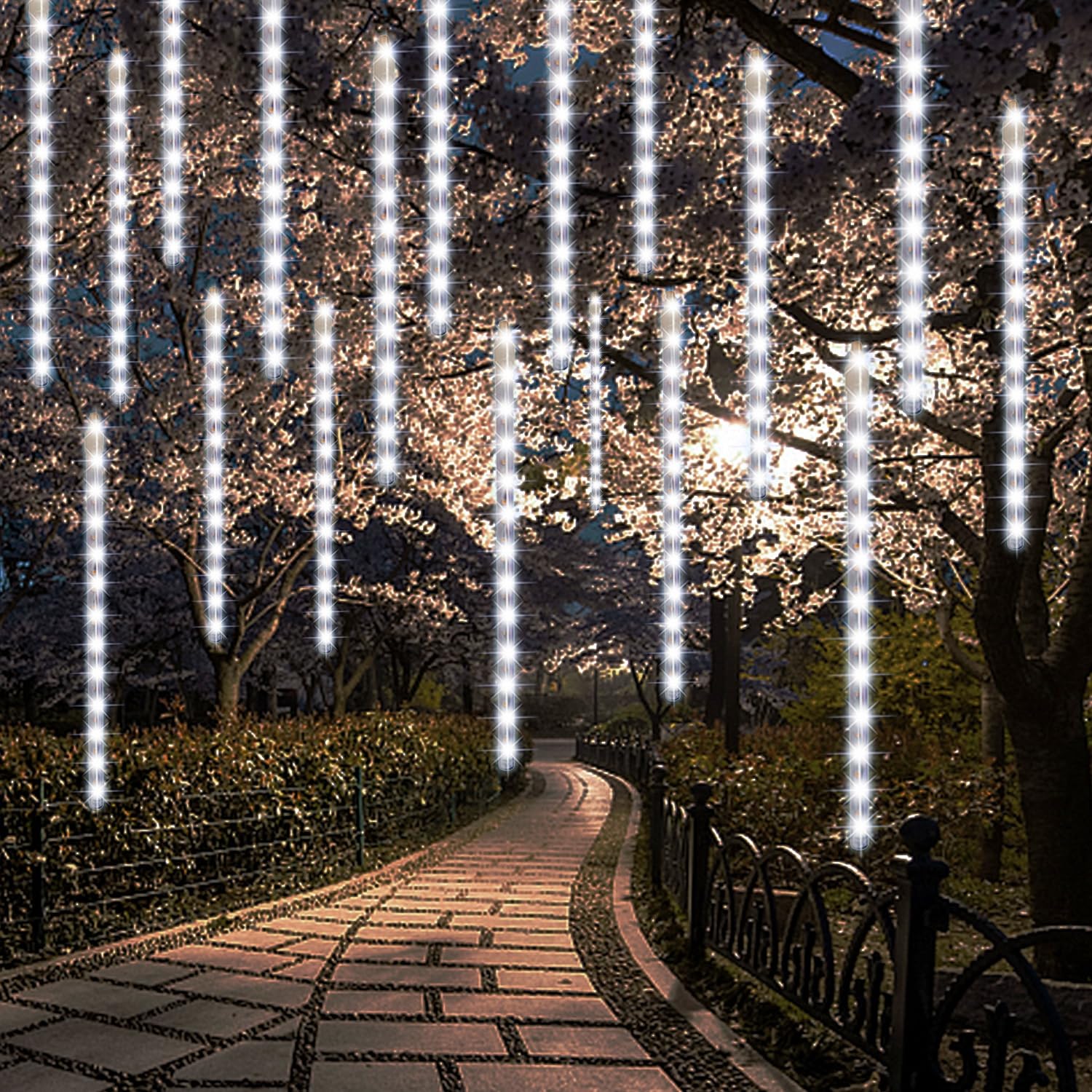 LJLNION 24-tube meteor shower lights brighten outdoor trees and rooftops.