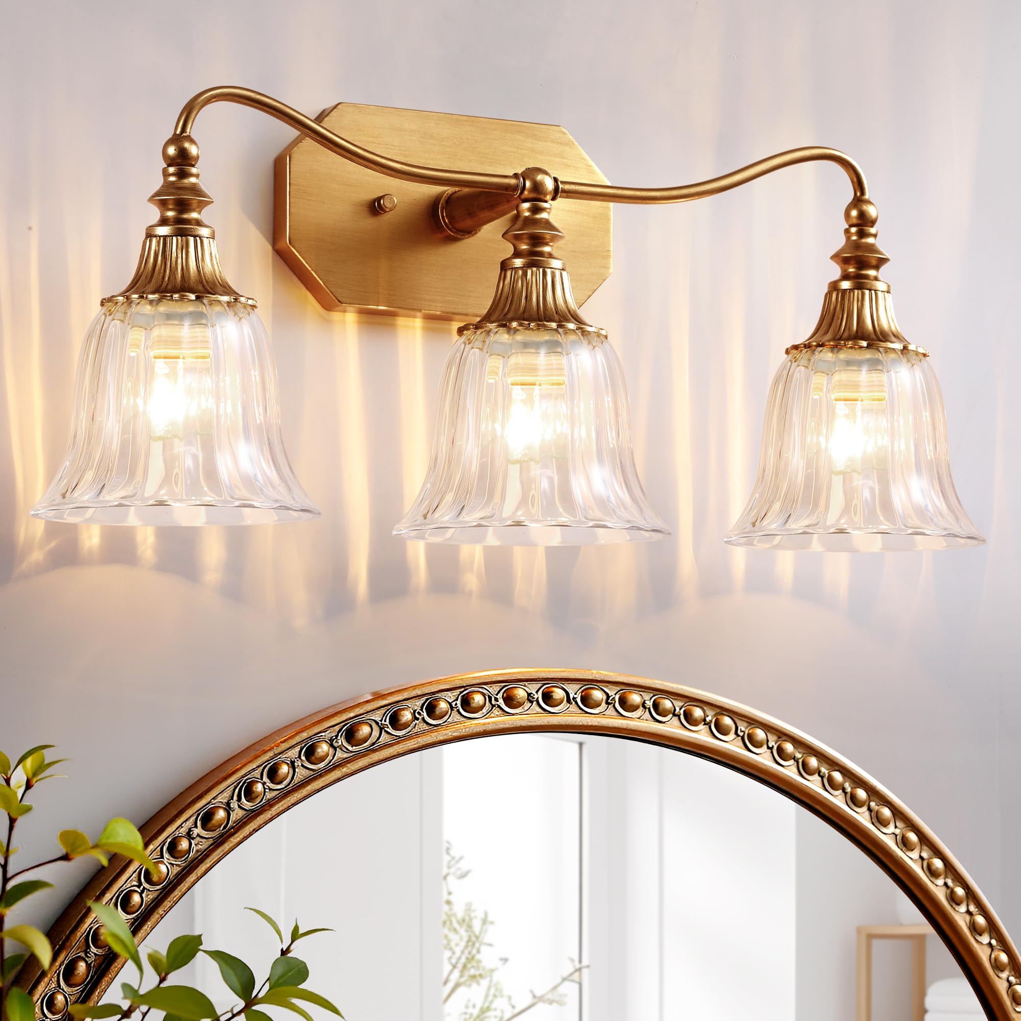 LmnLvn gold vanity light with crystal shade brightens bathrooms