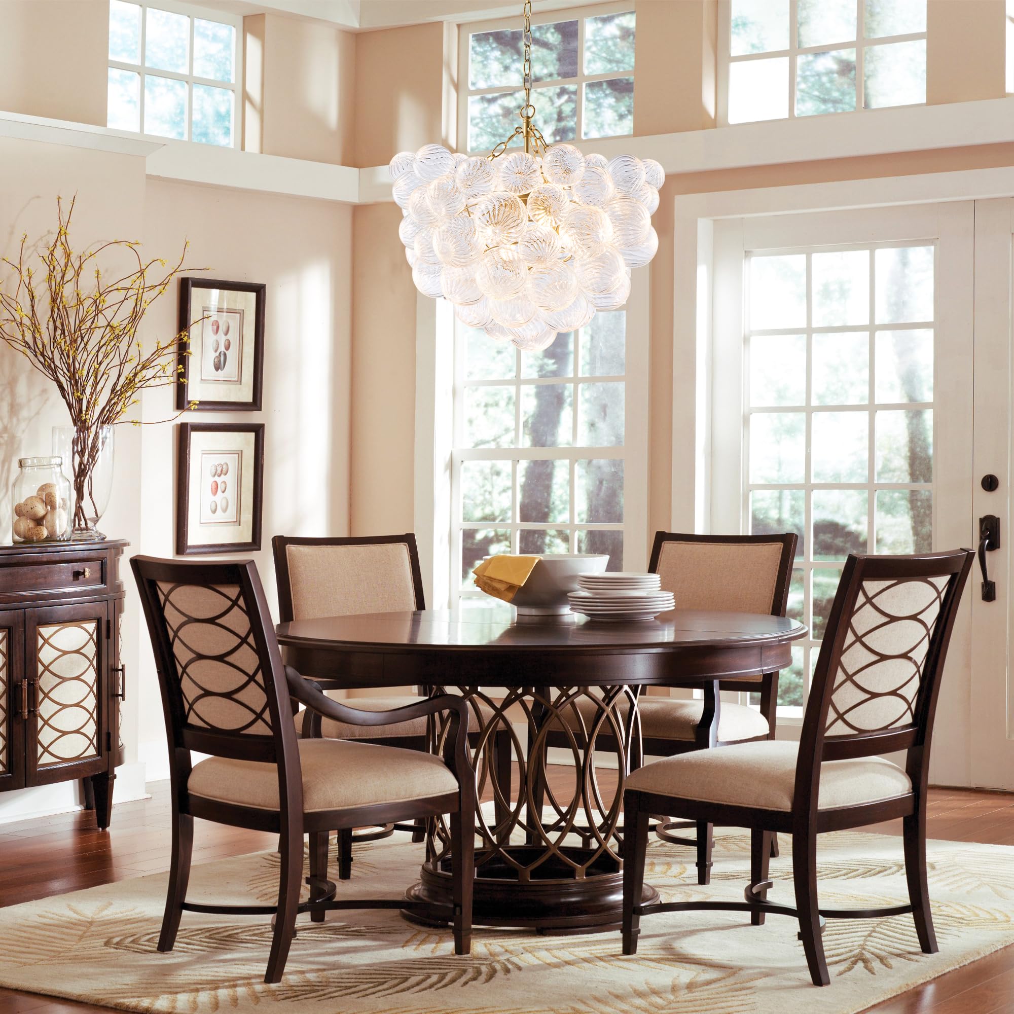 Longree dining room setting chandelier elevates conversations with elegant light.