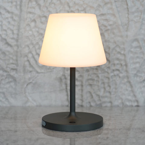 Lotitol outdoor table lamp with warm glow for cozy patio evenings.