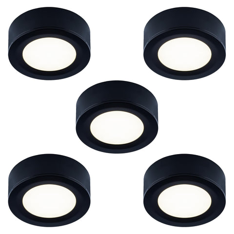 LUMILAND under-cabinet puck light delivers warm task lighting.
