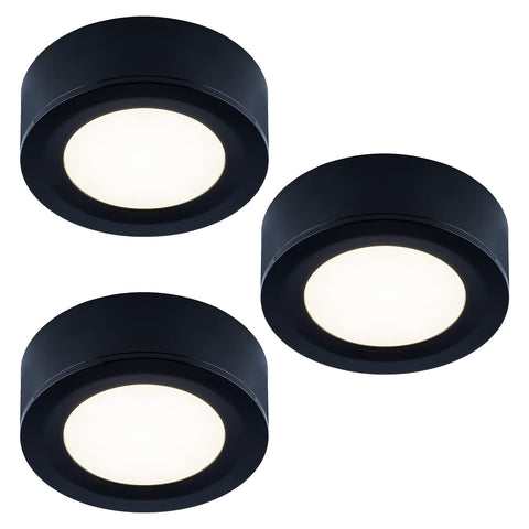 LUMILAND puck light, cabinet side view, compact task lighting for kitchens.