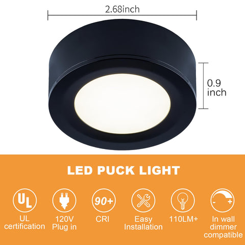 Close-up of LUMILAND puck light emitting diffused warm white glow.