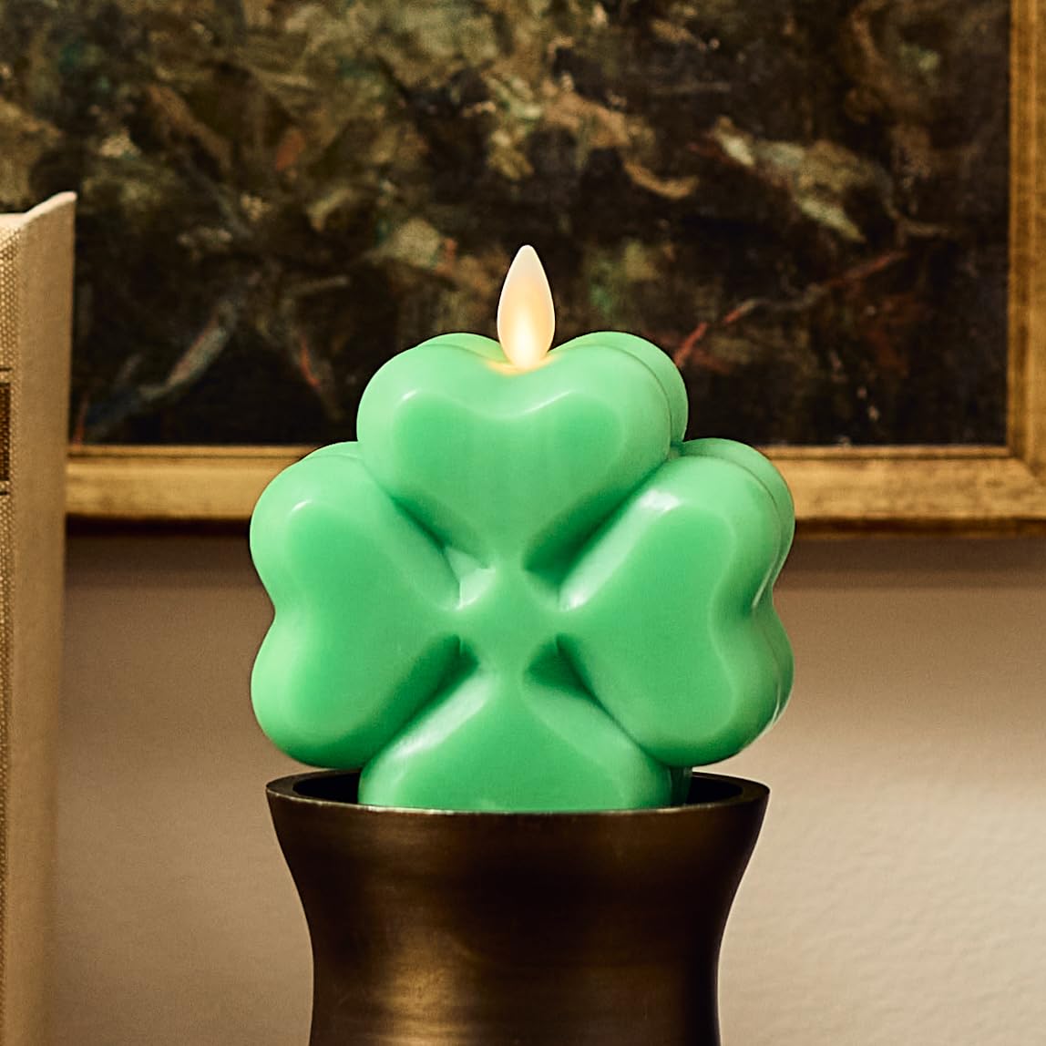 Luminara 4-Leaf Clover candle flicker close-up showing flameless real-flame effect.