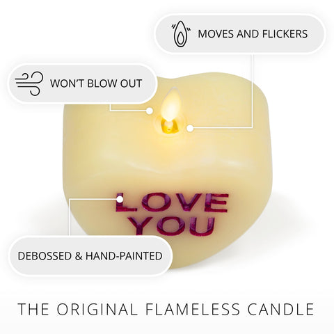 Luminara candy heart XOXO Pastel Orchid candle with warm inviting glow