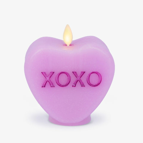 Luminara Candy Heart XOXO Pastel Orchid candle with realistic wax texture and warm LED glow.