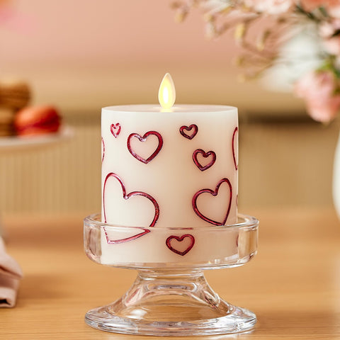 Luminara Debossed Hearts Pillar lit with lifelike flame-like flicker for ambiance