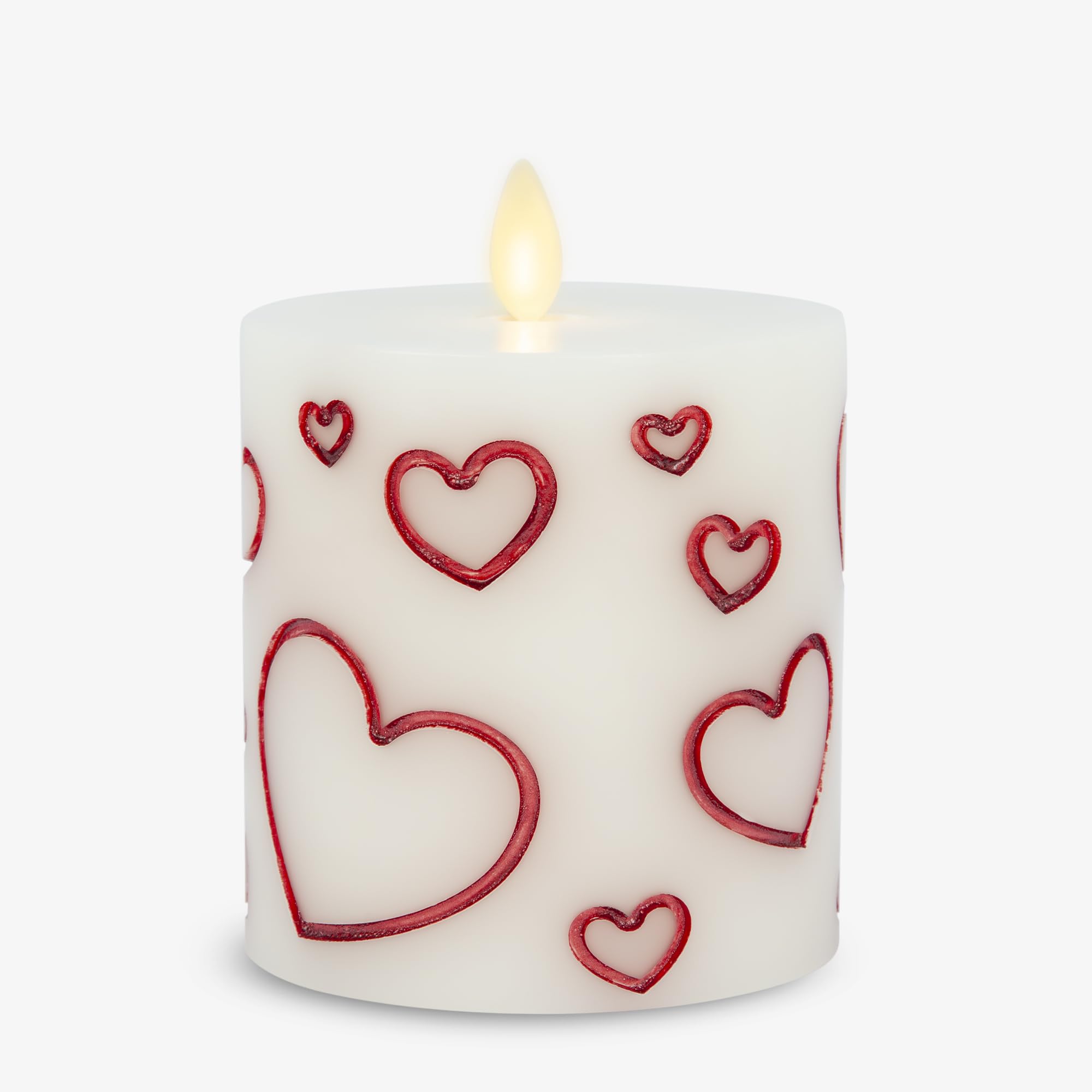 Luminara Debossed Hearts red pillar candle close-up with lifelike flicker for romantic ambiance.