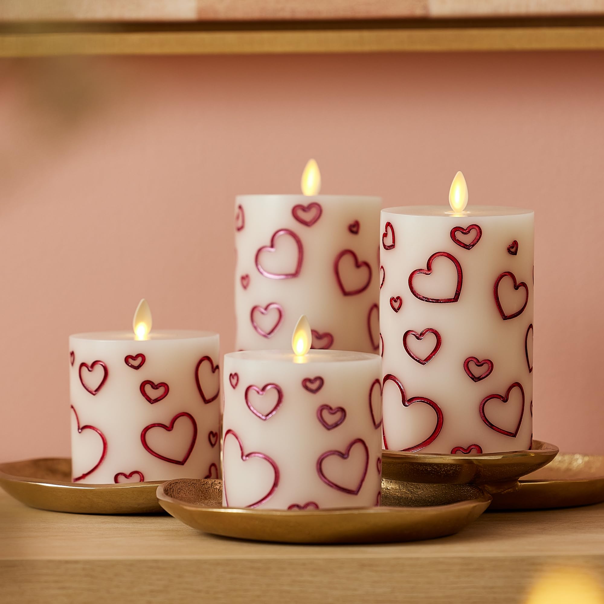 Luminara Debossed Hearts 6.5-inch candle glows to warm a room.