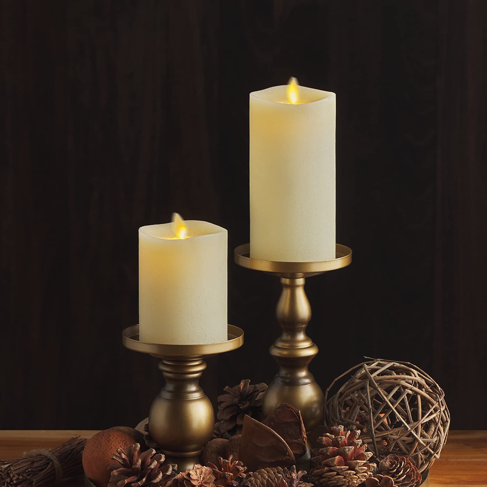 Luminara ivory flameless candle creates ambient light for events.