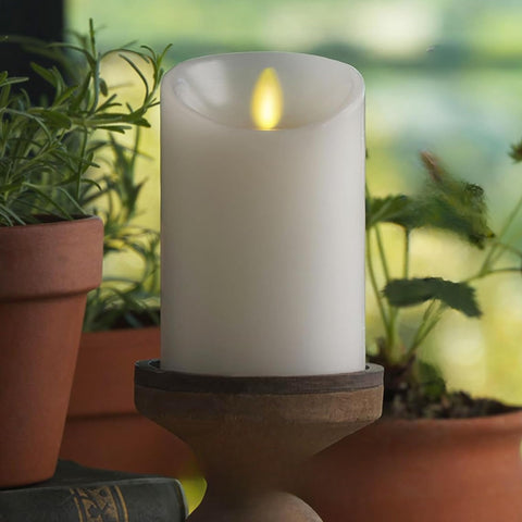 Luminara flameless pillar candle 4.5-inch white with realistic flame for safe indoor ambiance.