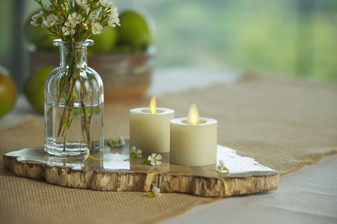 Luminara moving flame tealight ivory side view for safe ambient lighting.