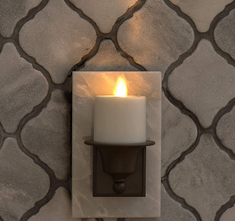 Luminara two-prong bronze night light keeps bottom outlet free