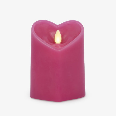 Luminara Raspberry Sorbet heart shaped pillar candle side view with warm glow