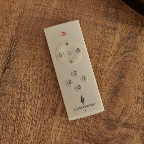 Luminara remote demonstrates on/off, dimming, and timer features for customizable ambiance.