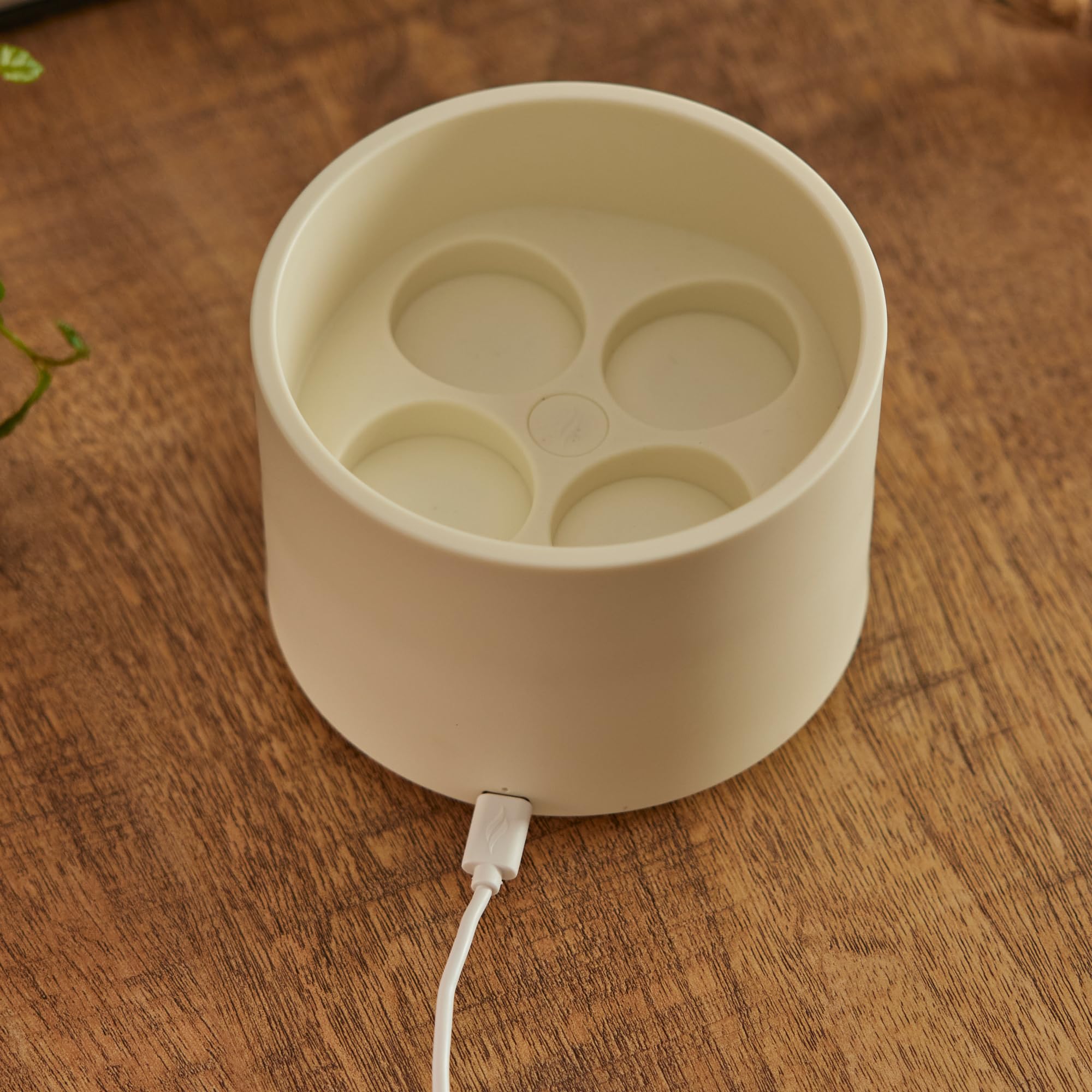 Luminara tealights on charging dock demonstrate wireless recharge convenience.