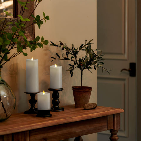 Luminara warm white flame flickers for authentic ambience.
