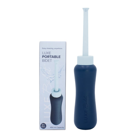 LUXE Bidet portable bottle in hand with ergonomic grip for on-the-go cleaning