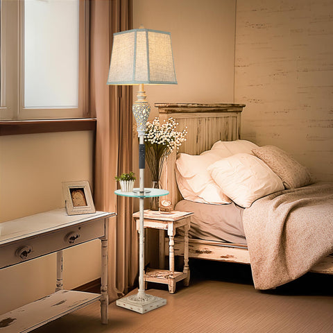 LuxSight Collection lamp features USB and A/C ports for device charging.