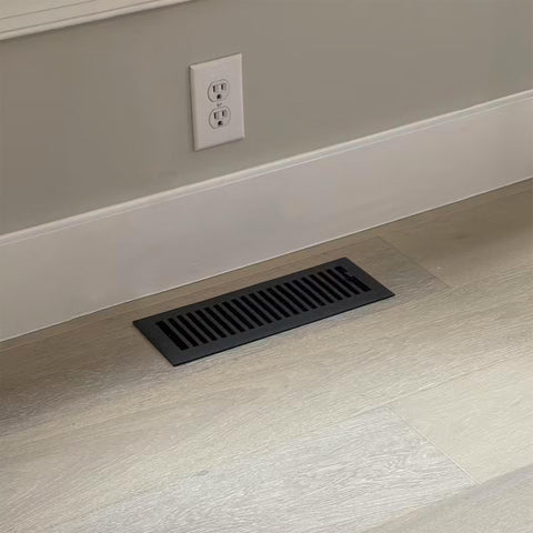 Madelyn Carter vent cover damper adjustment close-up showing airflow control