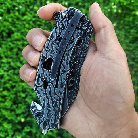 MADSMAUG knife with window breaker for vehicle safety scenarios.