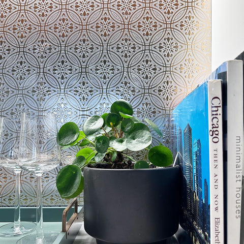 Main Street faux tin style adds metallic shimmer to bedroom.