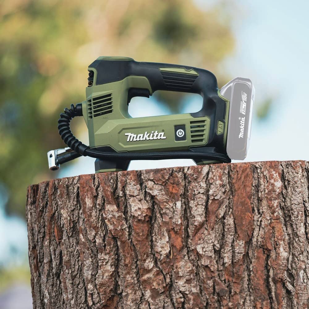 Makita ADMP180ZX inflator hose connection extends reach for versatile inflating tasks.