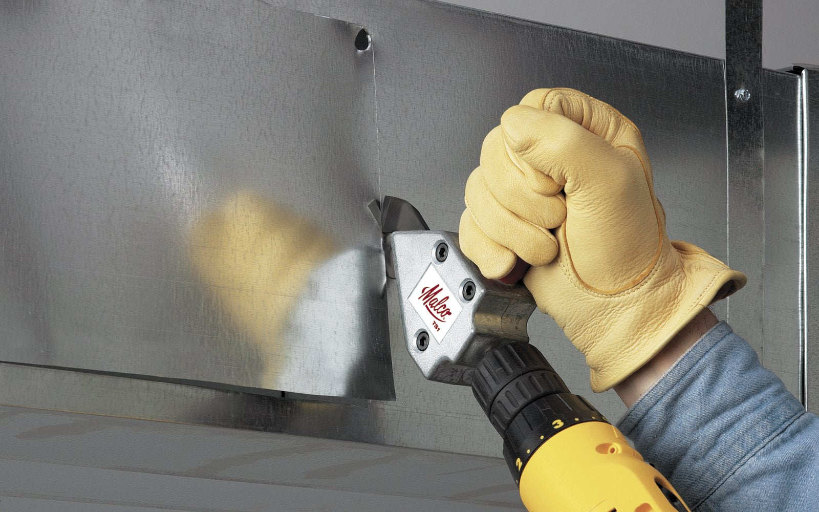 Malco TS1 Turbo Shear performing straight and left cuts for sheet metal tasks