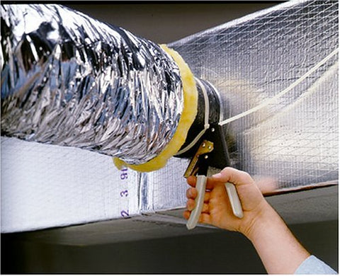 Malco TY4G in-action cutting excess nylon with precise blade for clean take-off connections.